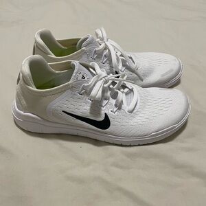 Nike White Sneakers with Black Logo
